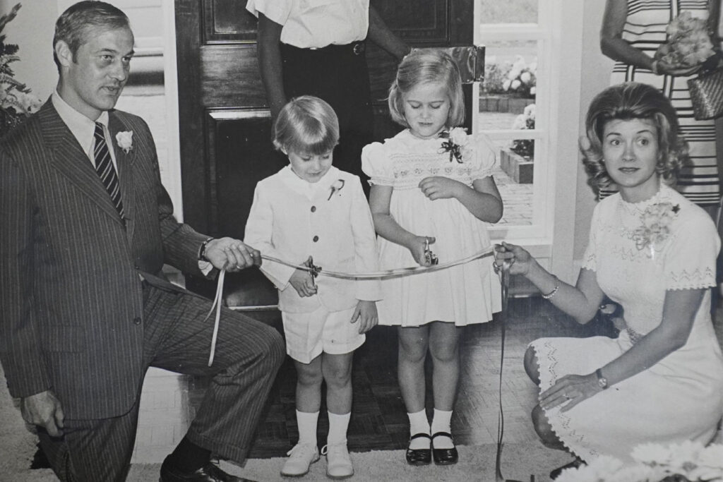 Fowler family at a ribbon-cutting ceremony, symbolizing a milestone in the Fowler Brothers' Legacy.