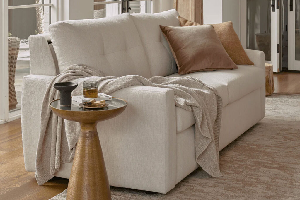 An American Leather sleeper sofa transformed into a comfortable bed, demonstrating its easy-to-use and practical design.