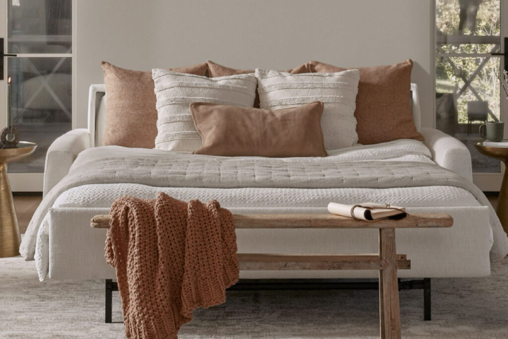 An American Leather sleeper sofa transformed into a comfortable bed, demonstrating its easy-to-use and practical design.