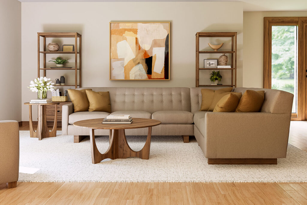 A living room set from the Stickley’s Walnut Grove Collection, with a sofa, coffee table, and bookshelves in a modern space.