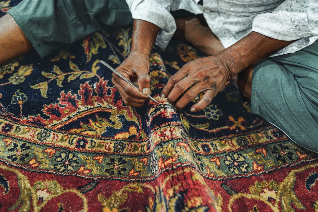 Stickley Designer Rug Month artisan handcrafting a designer rug at Fowler Brothers Co. Chattanooga