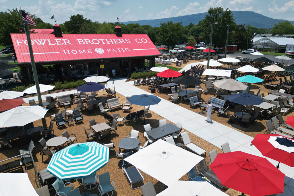 Aerial view of Fowler Brothers Co. Home & Patio outdoor furniture showroom in Chattanooga, showcasing patio sets and umbrellas from the Apollo Award 2025 winning retailer.