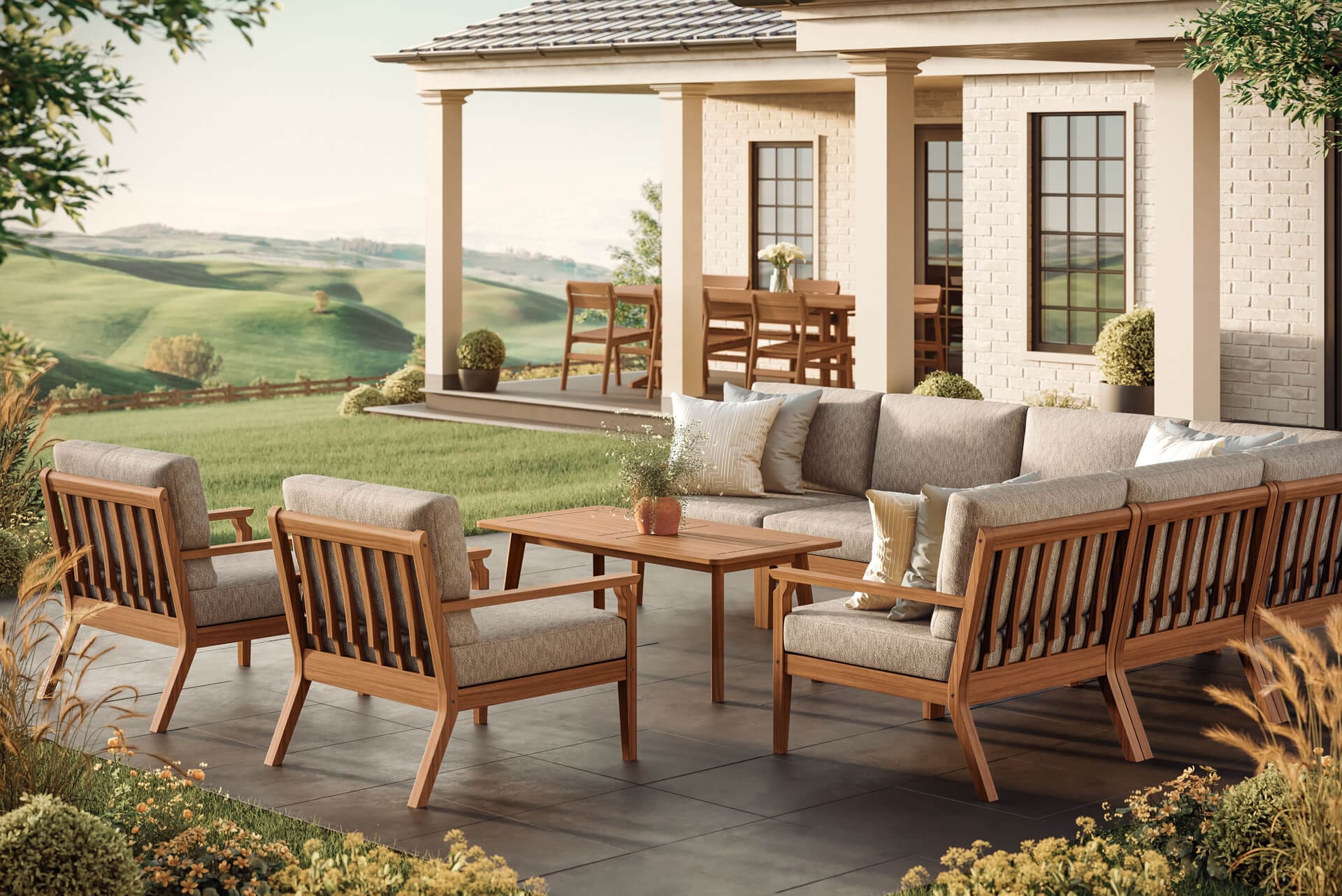 Outdoor furniture for fall featuring a teak sectional sofa and lounge chairs with Sunbrella cushions on a patio