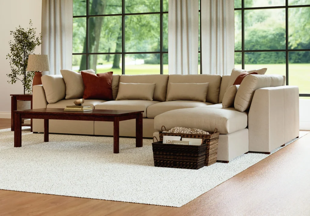 Stickley oak coffee table and side table in a warm neutral living room with a cream sectional and plush area rug