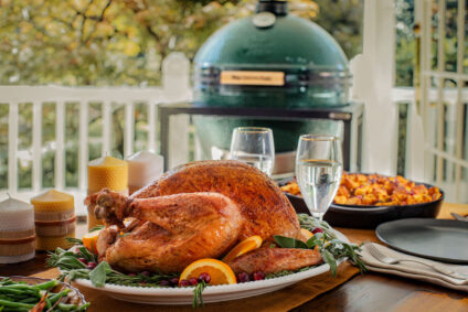 Thanksgiving menu ideas with a roasted turkey served on an outdoor table, prepared on the Big Green Egg grill